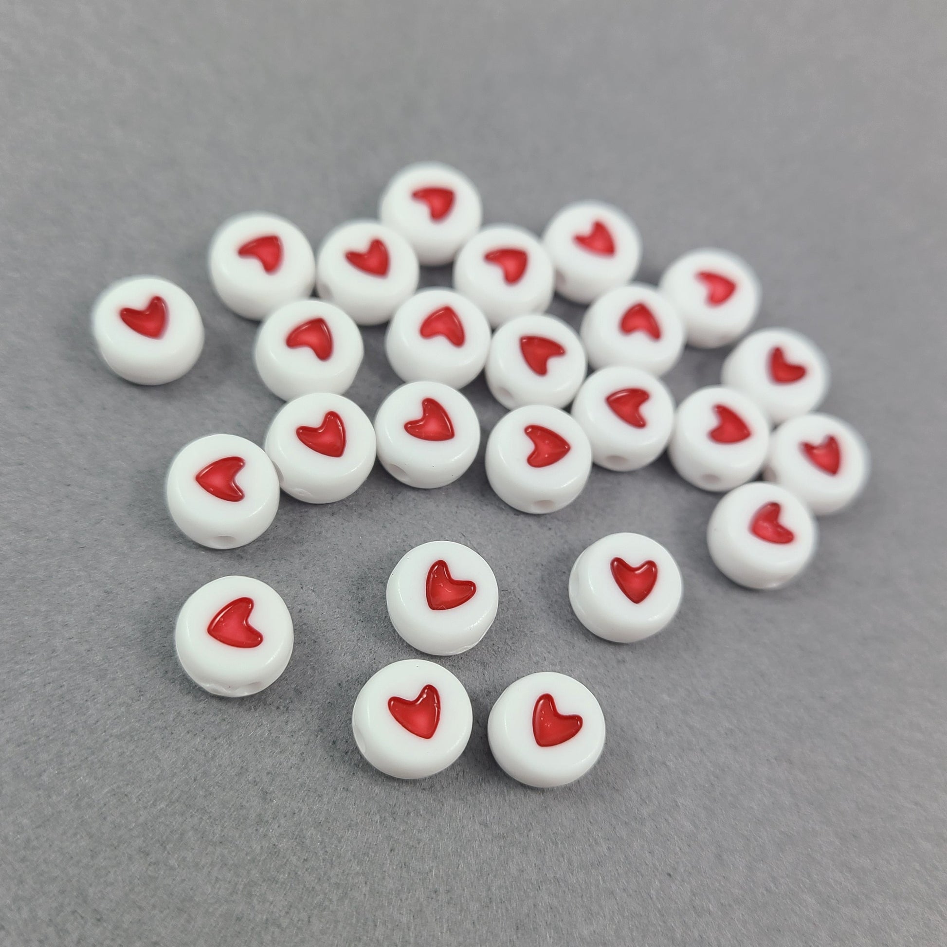 25 flat round heart beads