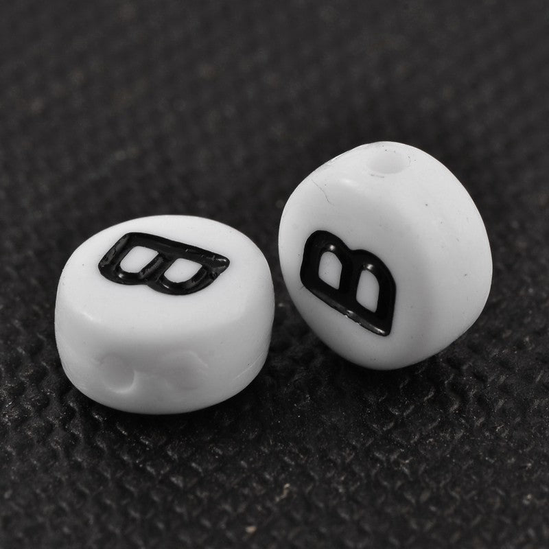 1 Black and white flat round letter bead
