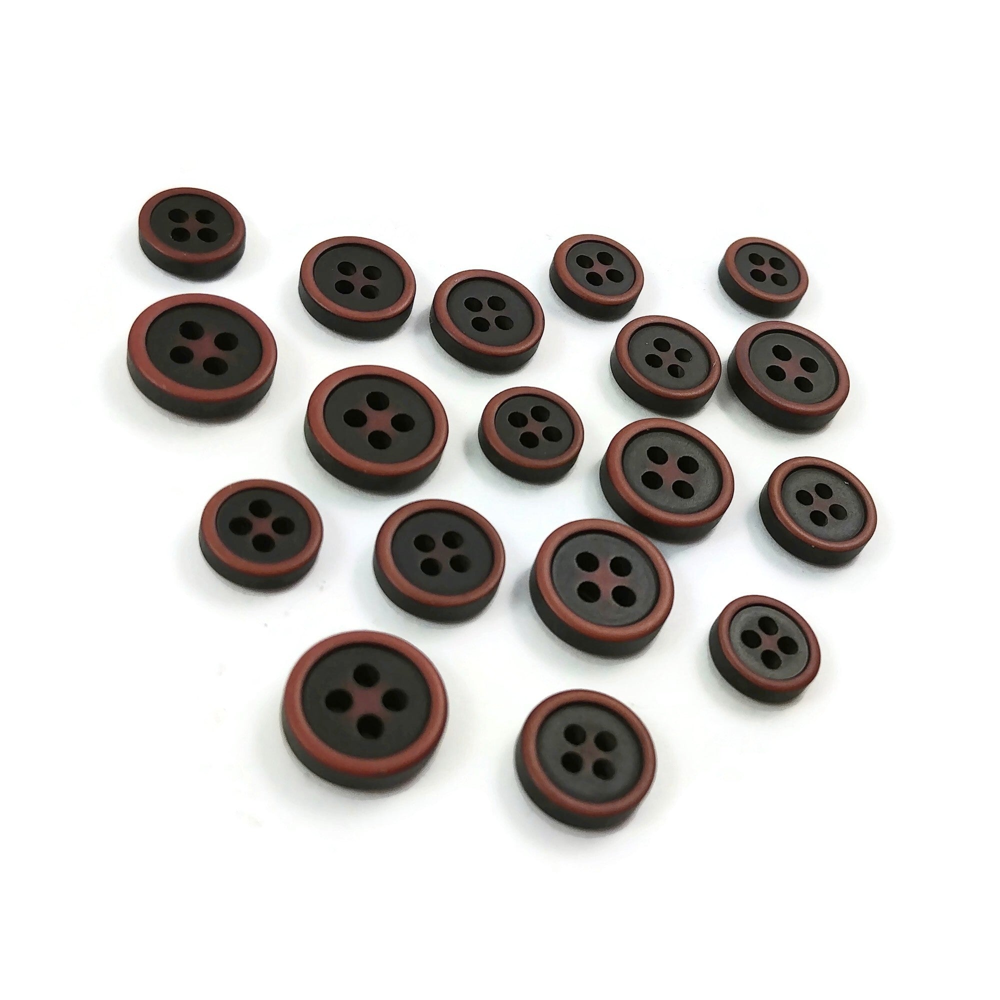 Resin and plastic sewing buttons