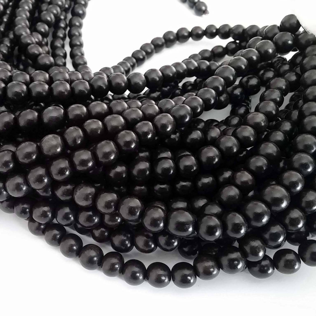Perles rondes en bois exotique noires 6 ou 8mm