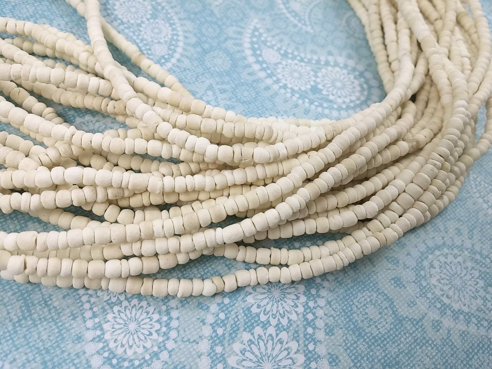 Tiny bleach white coconut beads 2-3mm